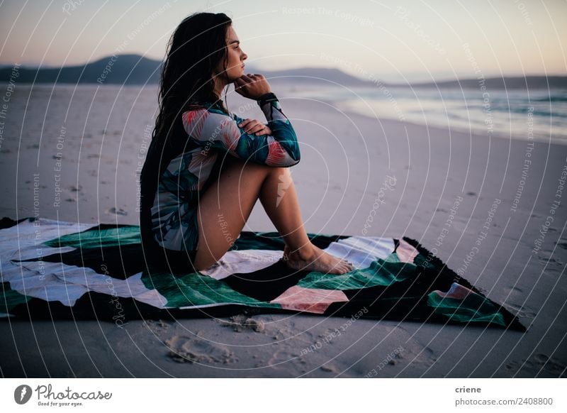Caucasian woman sitting in wet suit on towel at the beach Lifestyle Beautiful Body Relaxation Leisure and hobbies Vacation & Travel Summer Beach Ocean