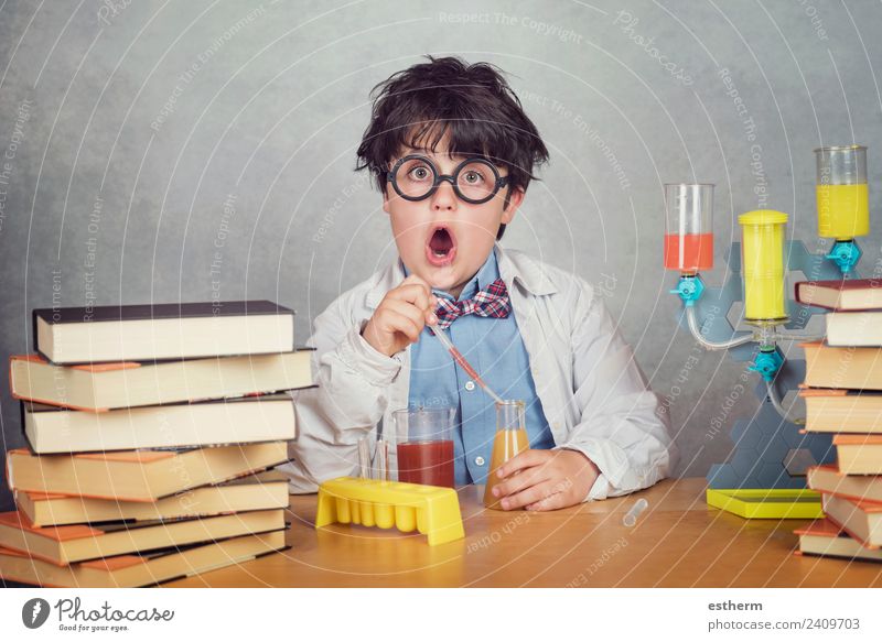 boy is making science experiments in a laboratory Lifestyle Education Science & Research School Study Schoolchild Laboratory Human being Masculine Child Toddler