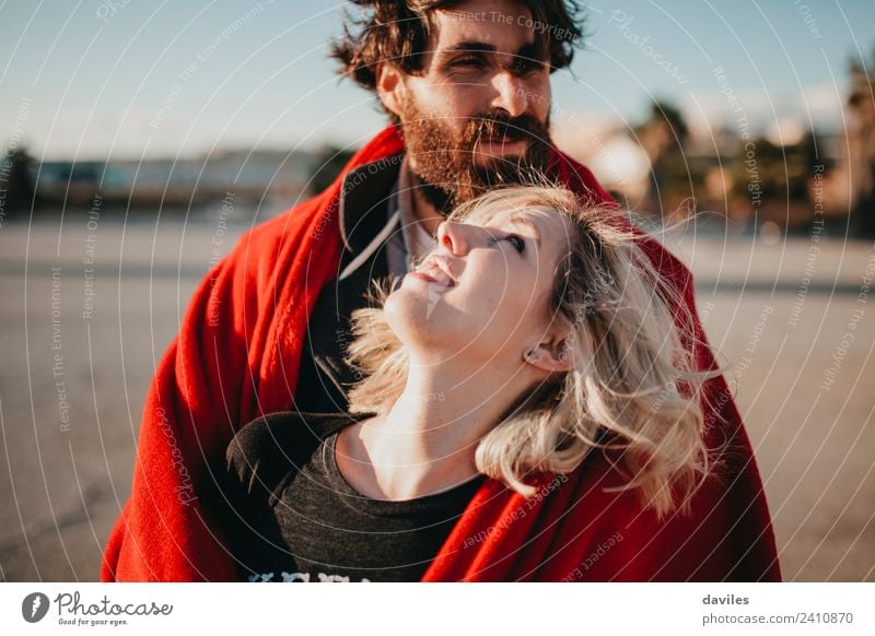 Portrait of blonde woman while looks at her boyfriend with beautiful sun light. Lifestyle Joy Beautiful Sun Woman Adults Man Couple Fashion Blonde Beard Smiling