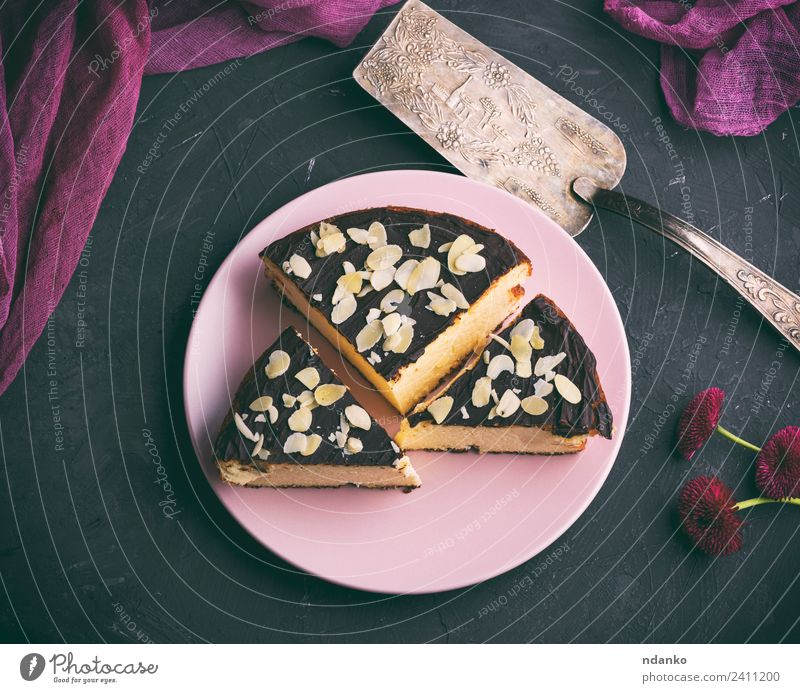 pieces of cheesecake with chocolate Cheese Dairy Products Dessert Candy Nutrition Restaurant Flower Fresh Delicious Above Black White Almond background Baking
