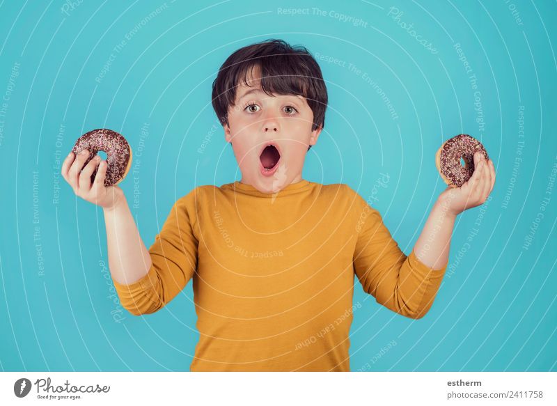 surprised boy with donuts in hands Food Roll Candy Chocolate Nutrition Breakfast Lunch Lifestyle Joy Human being Masculine Child Toddler Boy (child) Infancy 1