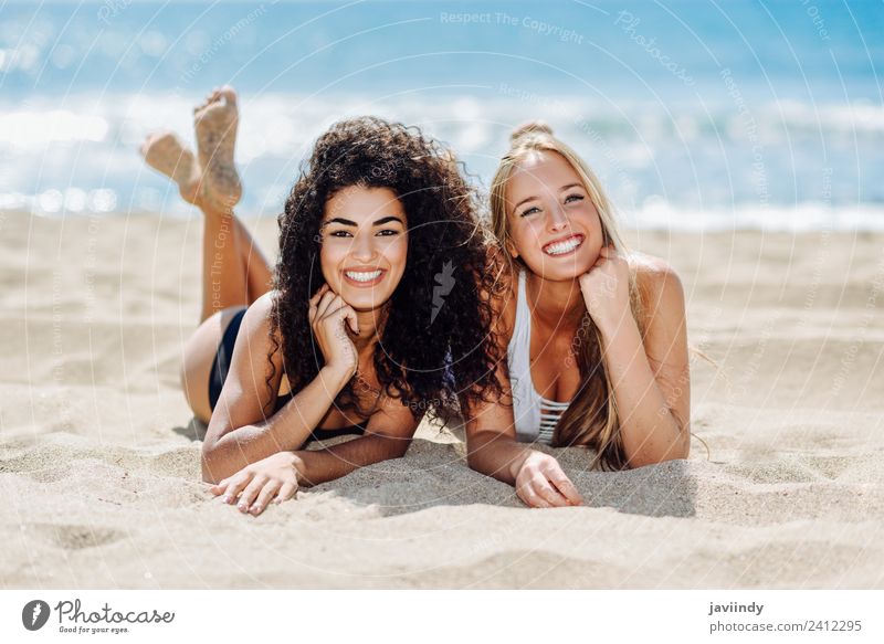 Two women on the sand of a tropical beach Joy Beautiful Leisure and hobbies Vacation & Travel Tourism Summer Beach Human being Feminine Woman Adults Friendship
