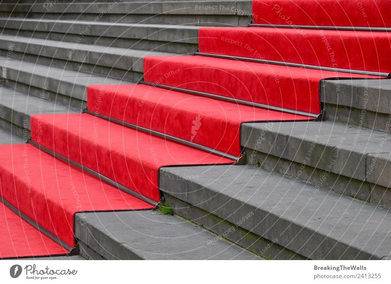 Close up red carpet over grey concrete stairs Design Feasts & Celebrations Manmade structures Building Architecture Stairs Stone Concrete Gray Red Perspective