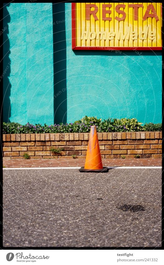 skittles Small Town Wall (barrier) Wall (building) Facade Street Illuminate Exotic Restaurant Traffic cone Wall plant Colour photo Exterior shot Deserted Light