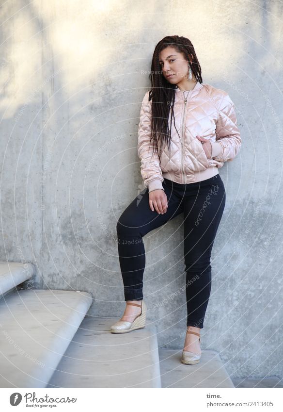 Nikoliya Feminine Woman Adults 1 Human being Wall (barrier) Wall (building) Stairs Pants Jacket Earring Brunette Long-haired Observe Looking Stand Cool (slang)