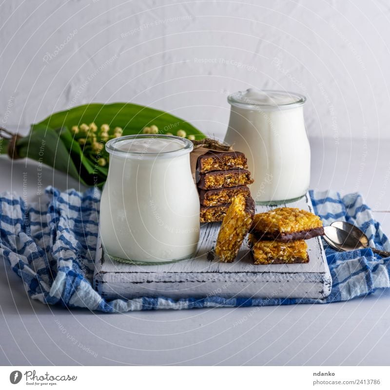 https://www.photocase.com/photos/2413786-homemade-yogurt-in-a-glass-jar-yoghurt-photocase-stock-photo-large.jpeg