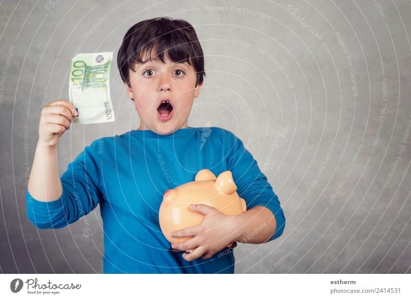 surprised child saving money in a piggy bank Lifestyle Shopping Luxury Joy Happy Money Economy Financial Industry Financial institution Success Human being