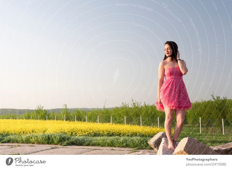 Woman in a pink dress at sunset Elegant Beautiful Calm Summer Adults Nature Meadow Brunette Smiling Happiness Yellow Green Joie de vivre (Vitality) Relaxation