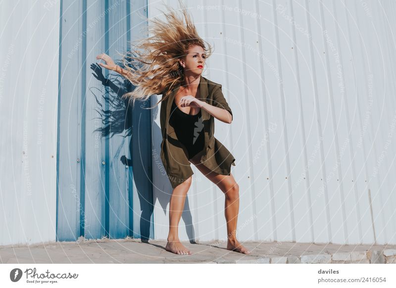 Blonde white woman dancing with energy with windy hair. Lifestyle Style Dance Human being Woman Adults 1 18 - 30 years Youth (Young adults) Dancer Street