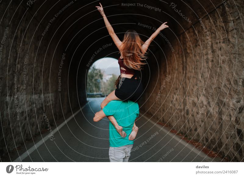 Couple having fun and walking in a tunnel Lifestyle Joy Vacation & Travel Trip Human being Woman Adults Man 2 18 - 30 years Youth (Young adults) Nature Street