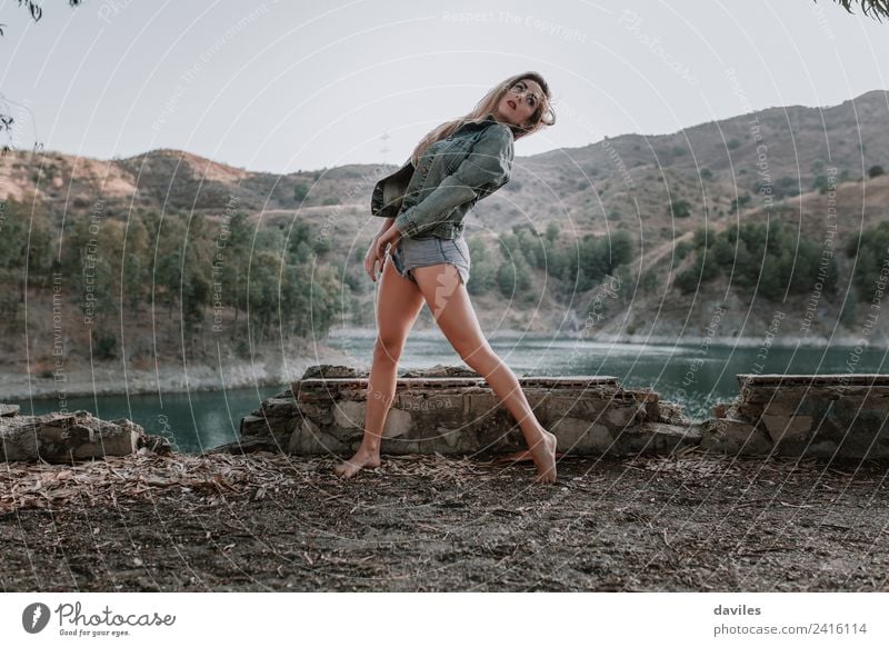 Woman dancing on the ground with a beautiful landscape in the background Lifestyle Style Beautiful Face Mountain Human being Feminine Adults 1 18 - 30 years