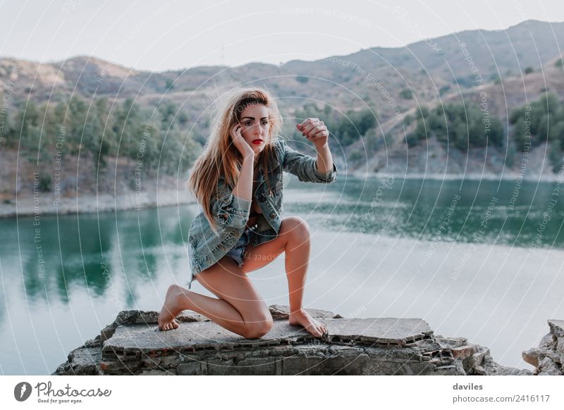 Woman dancing on a stone wall with a beautiful landscape in the background Lifestyle Style Beautiful Face Mountain Human being Adults 1 18 - 30 years
