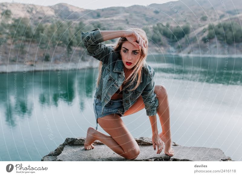 Woman in shorts and jacket posing in nature Lifestyle Style Beautiful Face Mountain Human being Adults 1 18 - 30 years Youth (Young adults) Dancer Nature Lake