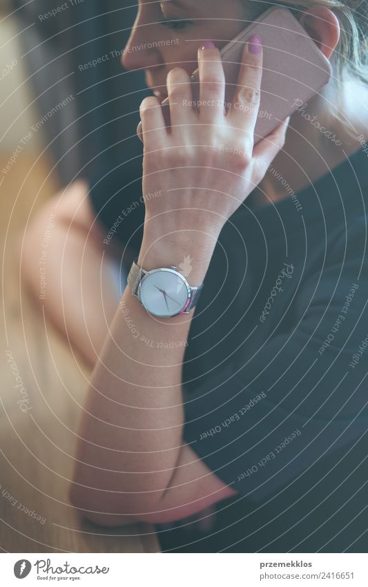 Woman calling on phone wearing blue dress and silver wristwatch Lifestyle Elegant Style Clock Business To talk Telephone Cellphone Technology Human being
