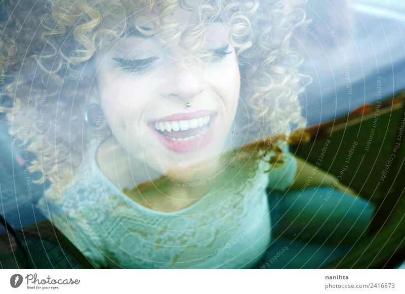 Young happy woman looking through a car window Lifestyle Style Design Joy Beautiful Hair and hairstyles Skin Face Wellness Leisure and hobbies Vacation & Travel