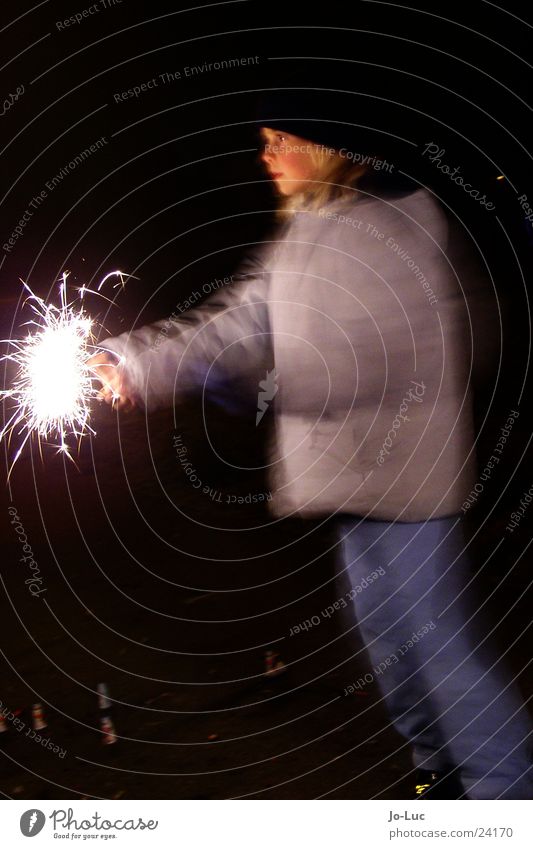 sparkling New Year's Eve Sparkler Spray Rustling Child Girl Night Light Long exposure Bright Face