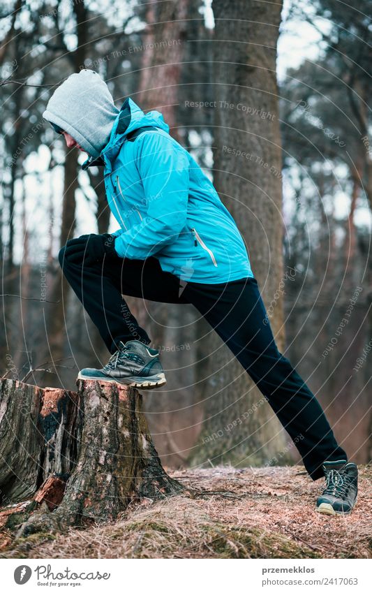 Young man exercising outdoors in a forest Lifestyle Athletic Fitness Relaxation Leisure and hobbies Winter Sports Jogging Human being Youth (Young adults) Man