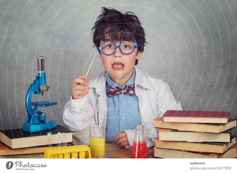 boy is making science experiments in a laboratory Education Science & Research Child Study Schoolchild Student Laboratory Human being Masculine Toddler