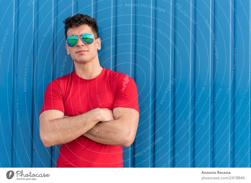 Red on blue Human being Man Adults 1 18 - 30 years Youth (Young adults) Sunglasses Brunette Blue 20-25 years old 20s 30 years old attractive Arabia door Latin