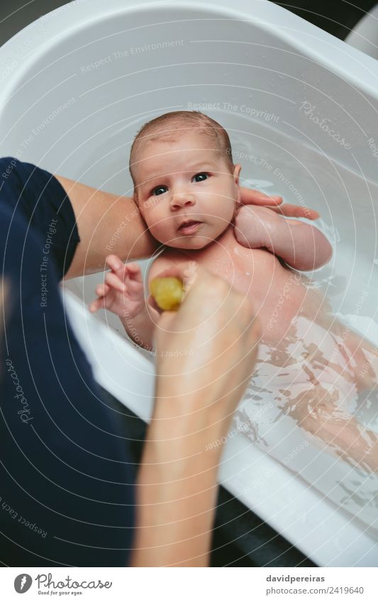 Newborn in the bathtub Lifestyle Beautiful Calm Bathtub Bathroom Child Human being Baby Woman Adults Mother Family & Relations Hand Authentic Small Modern Cute