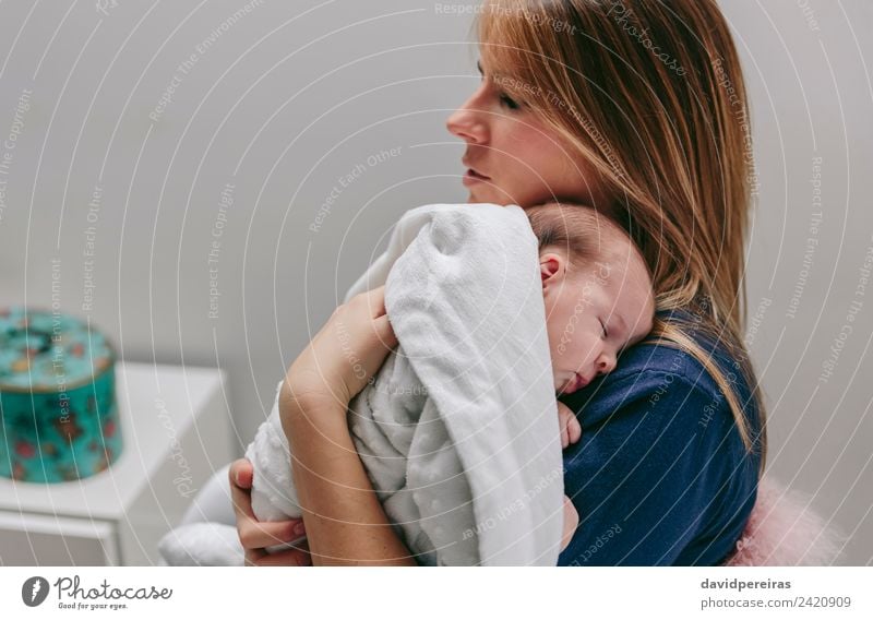 Mother hugging her sleeping baby girl Lifestyle Beautiful Calm Bedroom Child Human being Baby Woman Adults Family & Relations Infancy Arm Hand Blonde Love Sleep