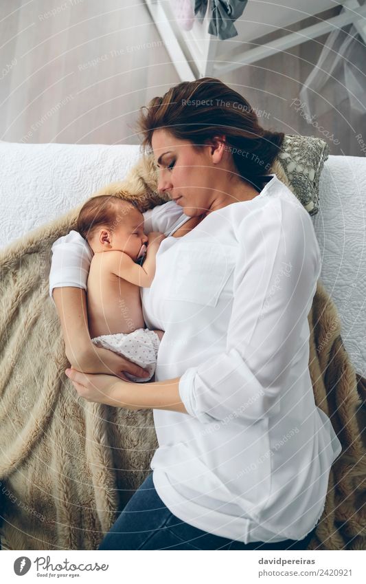Mother hugging her newborn baby girl Lifestyle Elegant Beautiful Bedroom Child Human being Baby Woman Adults Family & Relations Aircraft Love Embrace Authentic