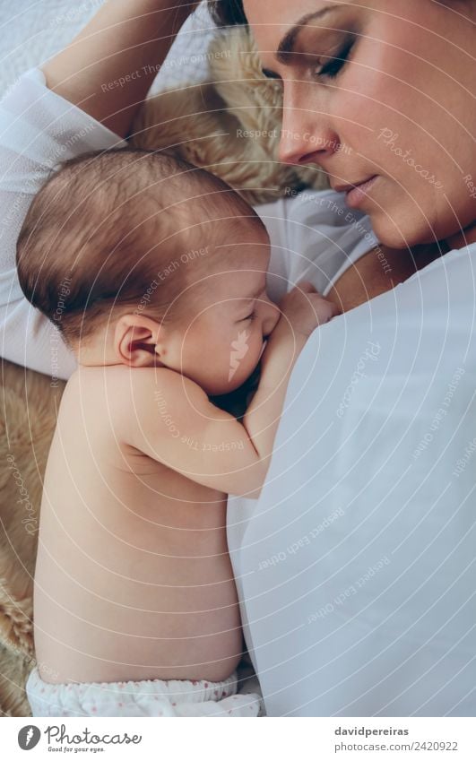 Mother hugging her newborn baby girl Lifestyle Elegant Beautiful Bedroom Child Human being Baby Woman Adults Family & Relations Aircraft Love Embrace Authentic