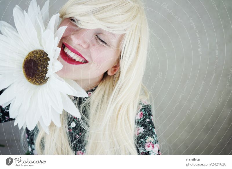 Happy blonde woman posing near a huge flower Style Design Joy Beautiful Hair and hairstyles Skin Face Lipstick Human being Feminine Woman Adults