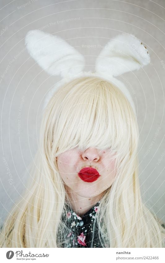 Young woman wearing rabbit ears and kissing Style Design Exotic Face Lipstick Feasts & Celebrations Carnival Easter Human being Feminine Youth (Young adults) 1