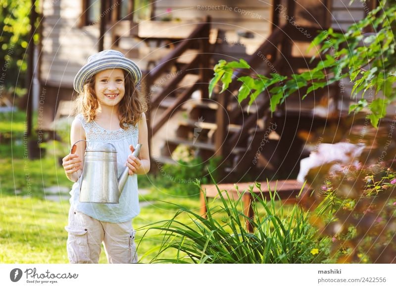 happy kid girl in hat playing little gardener Joy Happy Relaxation Playing Vacation & Travel Summer House (Residential Structure) Garden Child Infancy Flower