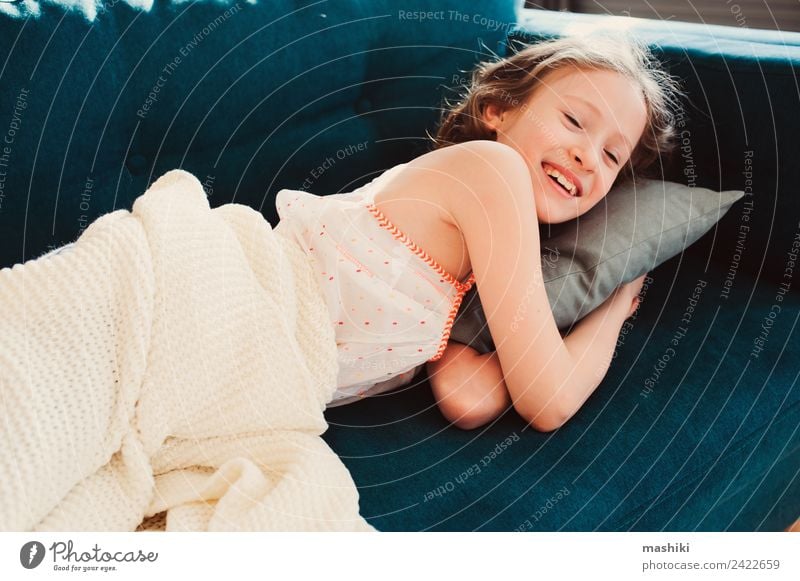kid girl relaxing at home in weekend morning Lifestyle Joy Relaxation Playing Flat (apartment) Child Infancy Fatigue Comfortable Home young laziness lazy casual
