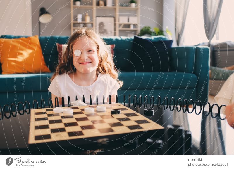 lifestyle shot of smart kid girl playing checkers at home Lifestyle Leisure and hobbies Playing Chess Success Child Parents Adults Family & Relations Infancy