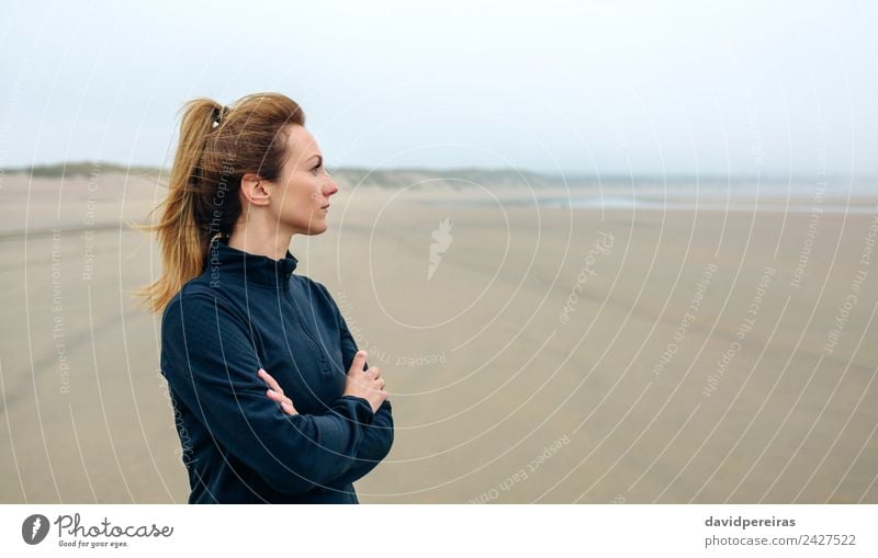 Woman looking at sea Lifestyle Beautiful Meditation Beach Ocean Human being Adults Sand Autumn Fog Think Sadness Authentic Loneliness Future worried walk Action