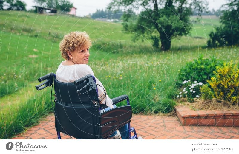 Senior woman in wheelchair Health care Relaxation Garden Retirement Human being Woman Adults Grandmother Nature Plant Tree Grass Old Sit Sadness Authentic