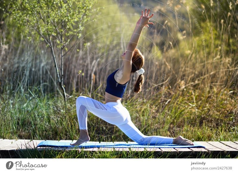 Young woman doing yoga in nature Lifestyle Happy Beautiful Body Relaxation Meditation Summer Sports Yoga Human being Youth (Young adults) Woman Adults 1