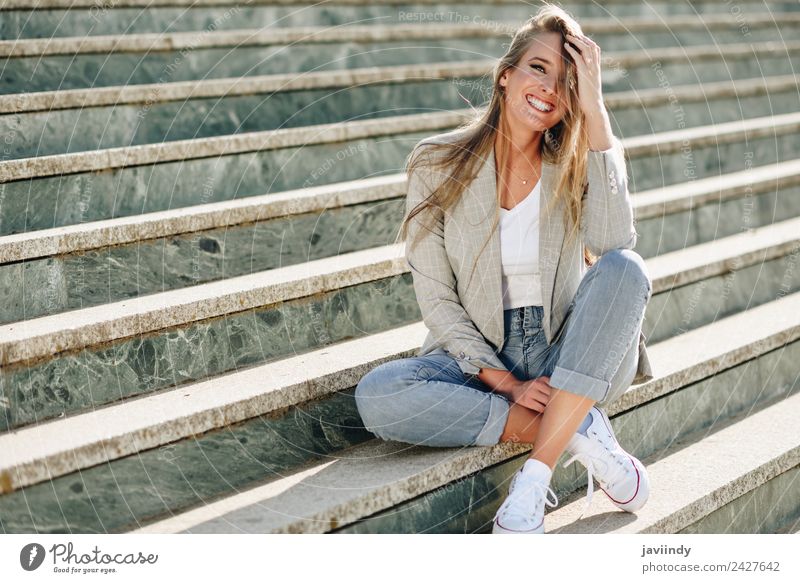 Blonde young caucasian woman smiling on steps Lifestyle Style Happy Beautiful Hair and hairstyles Human being Young woman Youth (Young adults) Woman Adults 1