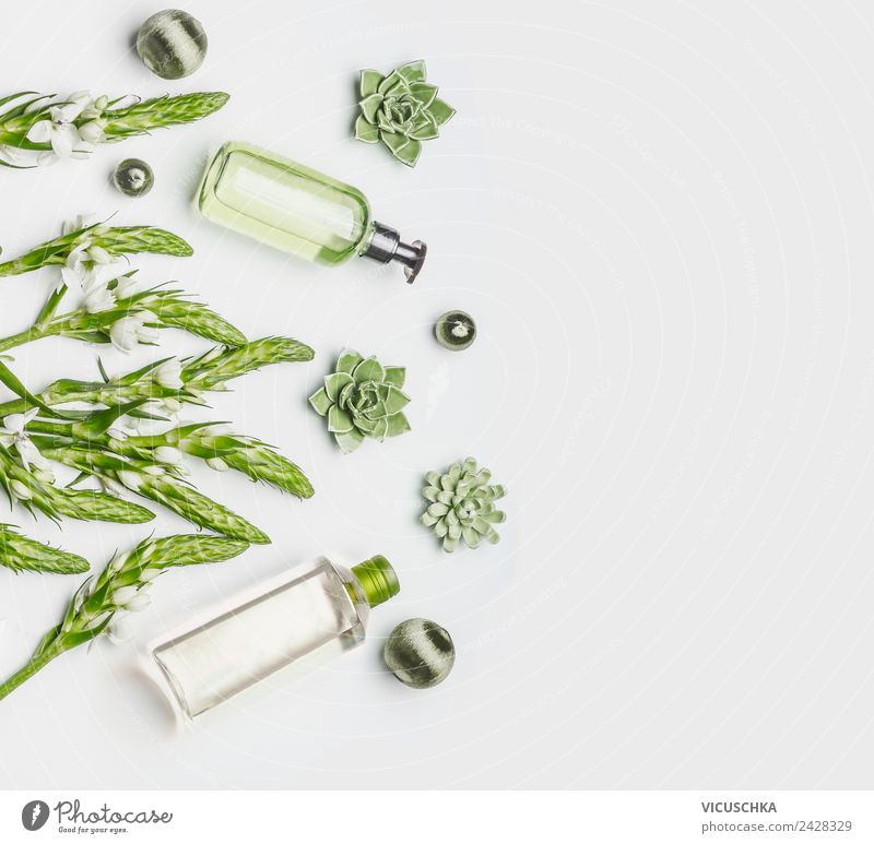 Green natural cosmetics in bottles Style Design Beautiful Personal hygiene Skin Cosmetics Healthy Wellness Spa Nature Plant Flower White Background picture