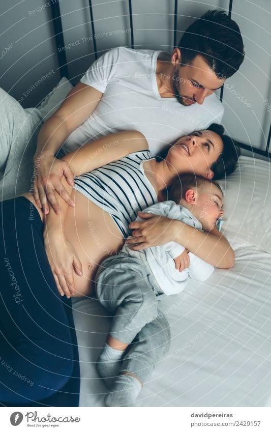 Pregnant with man and boy in bed Happy Beautiful Life Relaxation Bedroom Child Human being Baby Toddler Woman Adults Man Parents Mother Father
