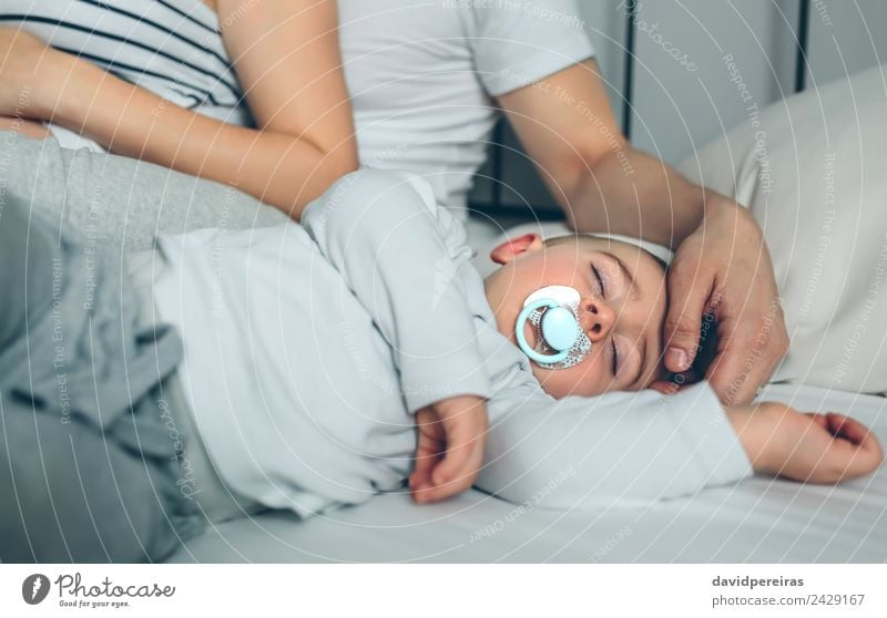 Baby asleep while parents caress Lifestyle Beautiful Calm Parenting Child Human being Toddler Boy (child) Woman Adults Man Parents Mother Father