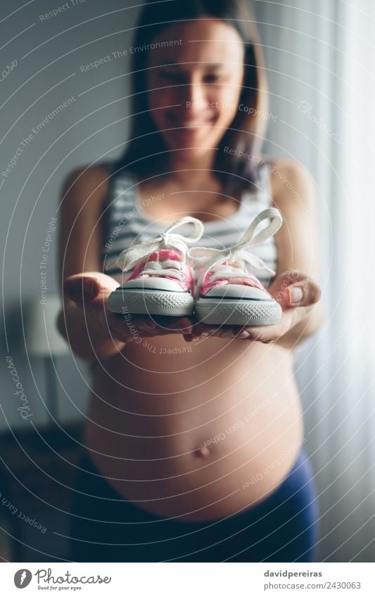 Baby sneakers held by pregnant Lifestyle Happy Beautiful Human being Woman Adults Mother Footwear Sneakers Smiling Wait Authentic Happiness Naked Pregnant Pink