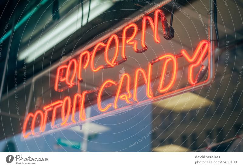Red neon sign with words Popcorn Cotton Candy Shopping Design Decoration Entertainment Signage Warning sign Glittering Write Dark Bright Retro Colour