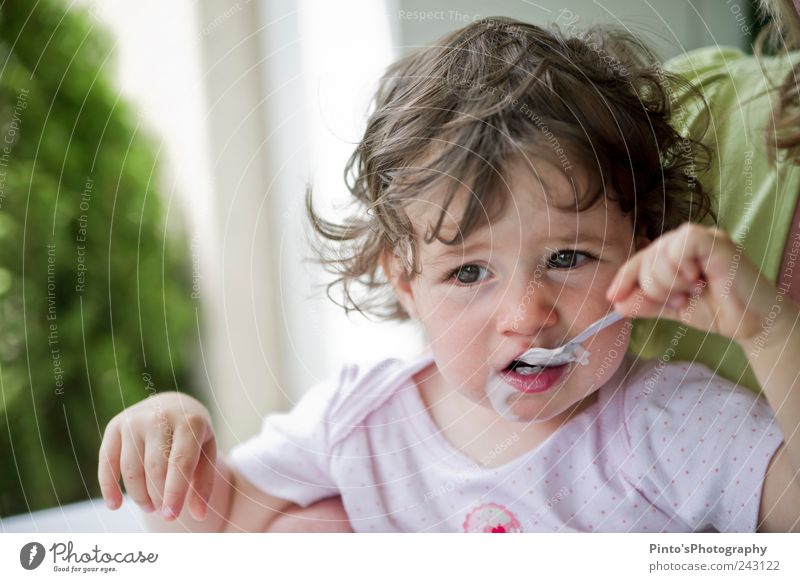 I'd rather have strawberry yogurt. Yoghurt Child Toddler Girl Infancy 1 Human being 1 - 3 years Eating Joie de vivre (Vitality) Colour photo Exterior shot