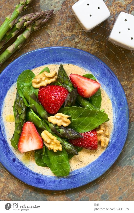 Strawberry Asparagus Spinach and Walnut Salad Vegetable Fruit Fresh food Raw walnut oil healthy Vegan diet Home-made Meal appetizer Snack served overhead