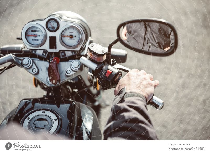 Senior man hand steering motorcycle on road Vacation & Travel Trip Adventure Mirror Human being Man Adults Hand Transport Street Vehicle Motorcycle Metal Old