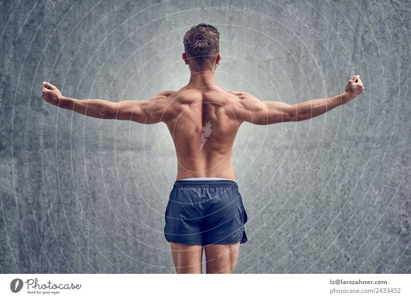 Young male bodybuilder posing Body Sports Man Adults 18 - 30 years Youth (Young adults) Fitness Muscular Strong Power back Posture background fit Musculature