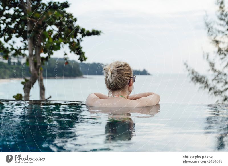 Back view of a blonde woman in the Infinity Pool Wellness Harmonious Well-being Contentment Senses Relaxation Calm Spa Swimming pool Swimming & Bathing