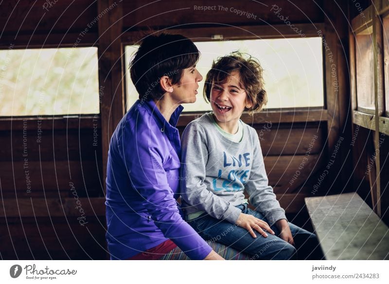 Mother with her seven year old daughter laughing in a cabin in the countryside Lifestyle Joy Child Feminine Girl Woman Adults Parents Family & Relations Infancy
