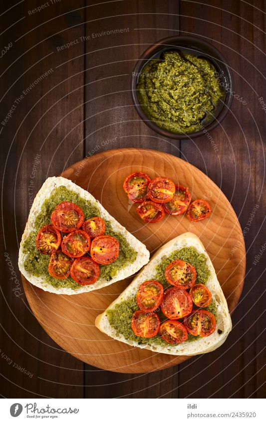 Bread Roll with Pesto and Roasted Tomato Vegetable Breakfast Vegetarian diet Fresh food olive pesto roasted topping Spread Sauce Basil pepper Snack brunch