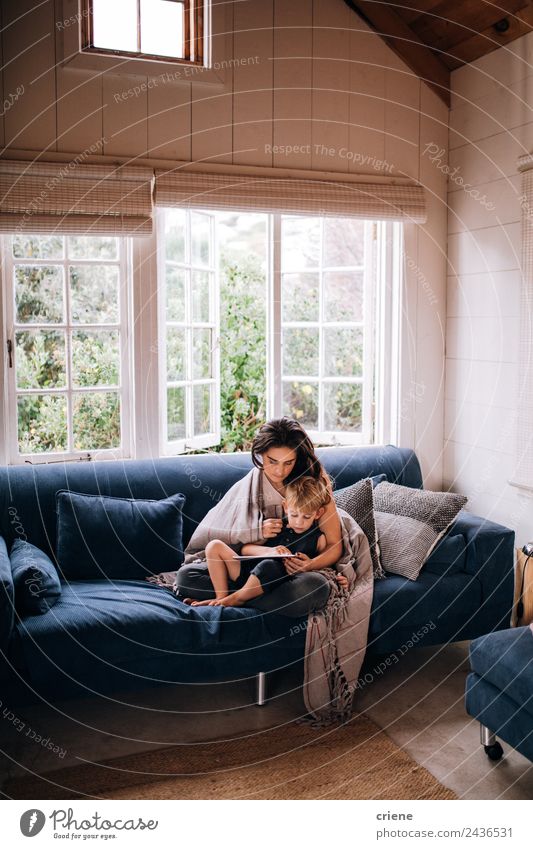 caucasian mother and son relaxing with tablet on couch Lifestyle Style Joy Happy House (Residential Structure) Sofa Child Technology Toddler Woman Adults