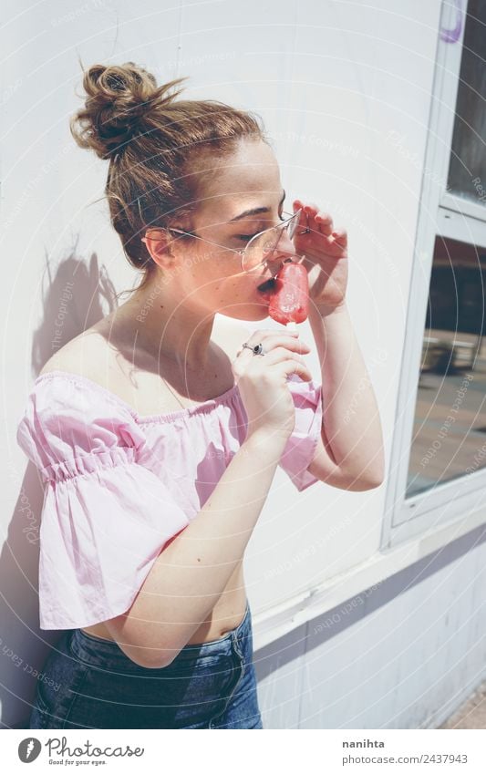 Young woman eating an ice cream in a summer day Food Ice cream Nutrition Eating Lifestyle Style Beautiful Hair and hairstyles Wellness Relaxation